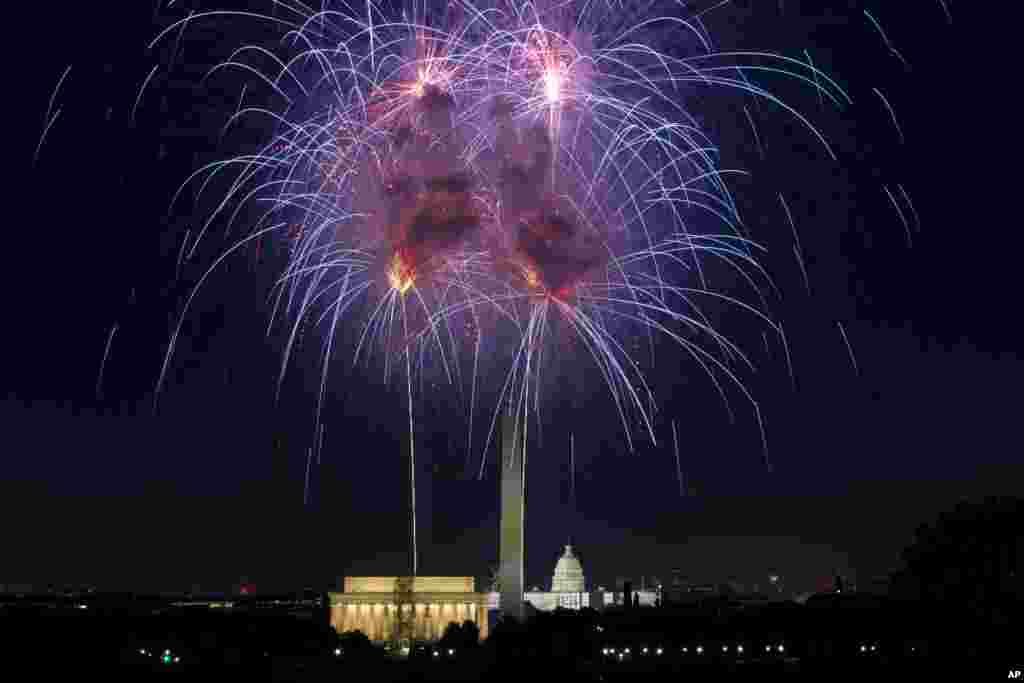 Fireworks explode over Lincoln Memorial, Washington Monument and U.S. Capitol along the National Mall in Washington, July 4, 2018, during the Fourth of July celebration.