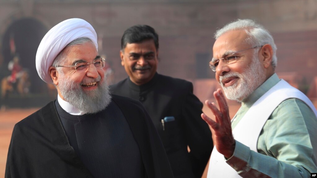 Indian Prime Minister Narendra Modi, right, talks to Iranian President Hassan Rouhani, left, during a ceremonial reception at the Indian presidential palace in New Delhi, India, Feb. 17, 2018.