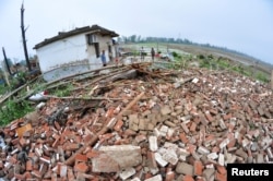 Debris of damaged houses is seen after a tornado hit Funing county, Yancheng, Jiangsu province, China, June 23, 2016.