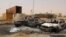 FILE - Vehicle wreckages are seen after a suicide car bomber blew himself at a checkpoint near Misrata, Libya, May 21, 2015.