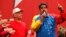 Venezuela's President Nicolas Maduro, right, speaks next to retired General Hugo Carvajal as they attend the Socialist party congress in Caracas, July 27, 2014. 
