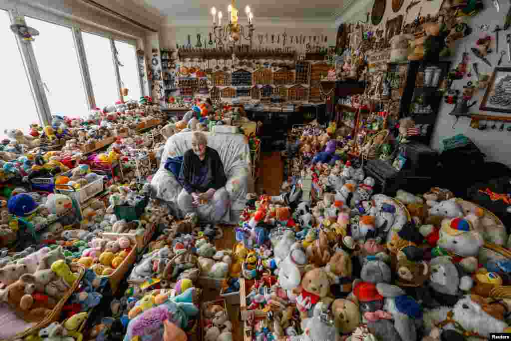 Belgian Catherine Bloemen, 86, sits among more than 20,000 stuffed and plastic toys, she has been collecting for more than 65 years, in her house in Brussels, Belgium.