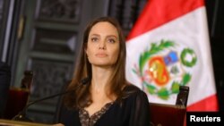 FILE - U.N. Refugee Agency’s special envoy Angelina Jolie attends a news conference at the government palace in Lima, Peru, Oct. 23, 2018. 