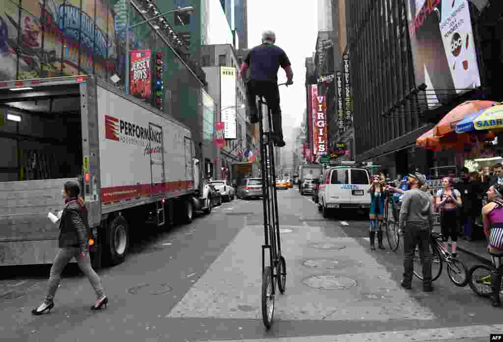 Costumed cast from the Cirque Mechanics’ new production, “Pedal Punk” make their way through Times Square, New York, to promote the show which is playing at the New Victory Theater through Jan. 3, 2016.