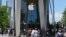 People wait in line outside an Apple store in the Brooklyn borough of New York City, June 22, 2020.