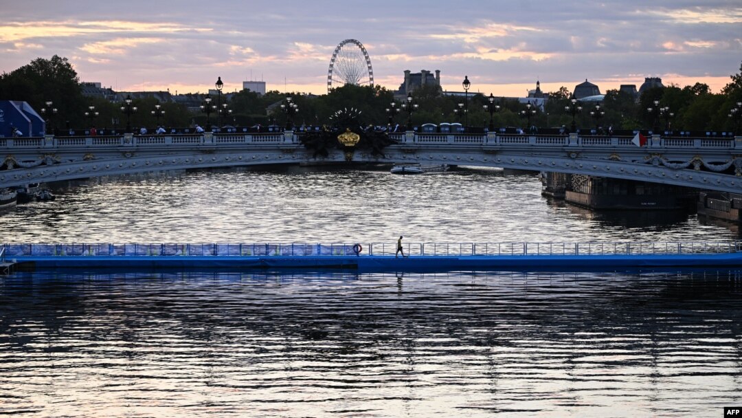 This photograph taken on Aug. 20, 2023, shows the starting line dedicated to the swim familiarisation event of the 2023 World Triathlon Olympic Games Test Event floating underneath the Alexandre III bridge on the Seine river ahead of the mixed relay 202