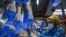 A worker inspects disposable gloves at the Top Glove factory in Shah Alam on the outskirts of Kuala Lumpur, Malaysia.