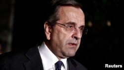 Greece's Prime Minister Antonis Samaras addresses journalists outside the Presidential palace in Athens, Nov. 3, 2014.