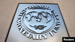FILE: International Monetary Fund logo is seen outside the headquarters building, Washington. Taken 4.20.2018