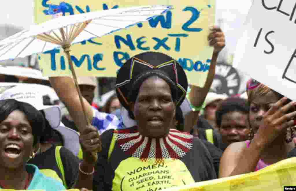 Environmental activists demonstrate outside the United Nations Climate Change conference (COP17) in Durban December 3, 2011. The protest march was part of a Global Day of Action to demand a fair climate change deal. REUTERS/Rogan Ward