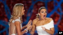 Miss New York, Mallory Hagan, right, reacts with Miss South Carolina Ali Rogers as she is crowned Miss America 2013 on Jan. 12, 2013, in Las Vegas.