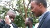 FILE - Erias Lukwago (L) and Forum for Democratic Change (FDC) representative Maj. Gen. Mugisha Muntu (R).