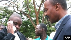 FILE - Erias Lukwago (L) and Forum for Democratic Change (FDC) representative Maj. Gen. Mugisha Muntu (R).