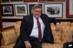 President Donald Trump's attorney general nominee, William Barr, meets with Senate Judiciary Committee member and Trump confidant Sen. Lindsey Graham, R-S.C., on Capitol Hill in Washington, Jan. 9, 2019.