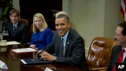 President Barack Obama meets with technology executives at the White House in Washington, Dec. 17, 2013. From left, Mark Pincus, founder, Chief Product Officer & Chairman, Zynga; Marissa Mayer, President and CEO, Yahoo!, Obama, and Randall Stephenson, Chairman & CEO, AT&T.