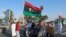 FILE - Protesters demonstrate against U.N. draft agreement for political settlement between parallel governments, Benghazi, Libya, Sept. 18, 2015.