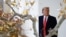 President Donald Trump waits outside the Oval Office of the White House on the South Lawn in Washington, Nov. 26, 2019.