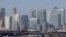 FILE - London's financial district in Canary Wharf, London, March 25, 2020. 