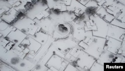 An aerial view of buildings during a blizzard in Buffalo, New York, Dec. 26, 2022, in this screengrab obtained from a social media video. Mostofa Ahsan/via REUTERS