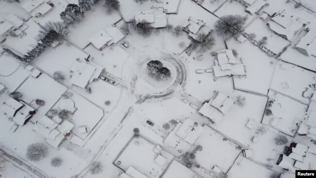 An aerial view of buildings during a blizzard in Buffalo, New York, Dec. 26, 2022, in this screengrab obtained from a social media video. Mostofa Ahsan/via REUTERS