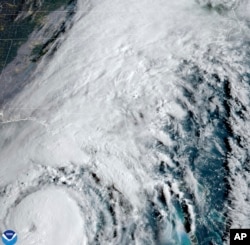 This satellite image provided by NOAA shows Hurricane Helene advancing across the Gulf of Mexico toward Florida, Sept. 26, 2024.