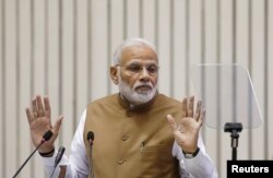 FILE - India's Prime Minister Narendra Modi gestures as he addresses a gathering in New Delhi, India, Sept. 7, 2018.