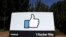 FILE - The Facebook logo is seen at the company's headquarters in Menlo Park, Calif., March 28, 2018. 