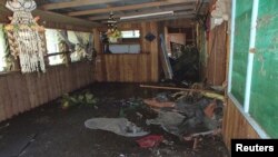 A damaged house is seen after a tsunami hit the Venga village in Solomon Islands, February 6, 2013. 