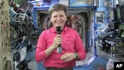 FILE - NASA, astronaut Peggy Whitson speaks during an interview aboard the International Space Station.