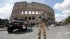 FILE - A soldier patrols in front of the Colosseum in Rome, Apr. 14, 2017. Italian army will start guarding medical staff at a hospital in the southern Calabria region from Monday, after a string of violent attacks on doctors and nurses.