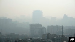 FILE - Iran is facing closures because of cold weather, energy shortages and severe air pollution.