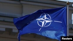 NATO flag flutters during the celebration of the 15th anniversary of Lithuania's membership in NATO in Vilnius, Lithuania, March 30, 2019.