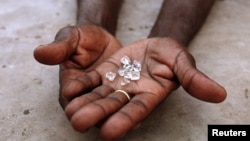 FILE - Illegal diamonds from Zimbabwe are displayed for sale in Manica, Mozambique.