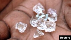 FILE - Illegal diamonds from Zimbabwe are displayed for sale in Manica, Mozambique.