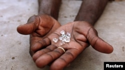 FILE - Illegal diamonds from Zimbabwe are displayed for sale in Manica, Mozambique.