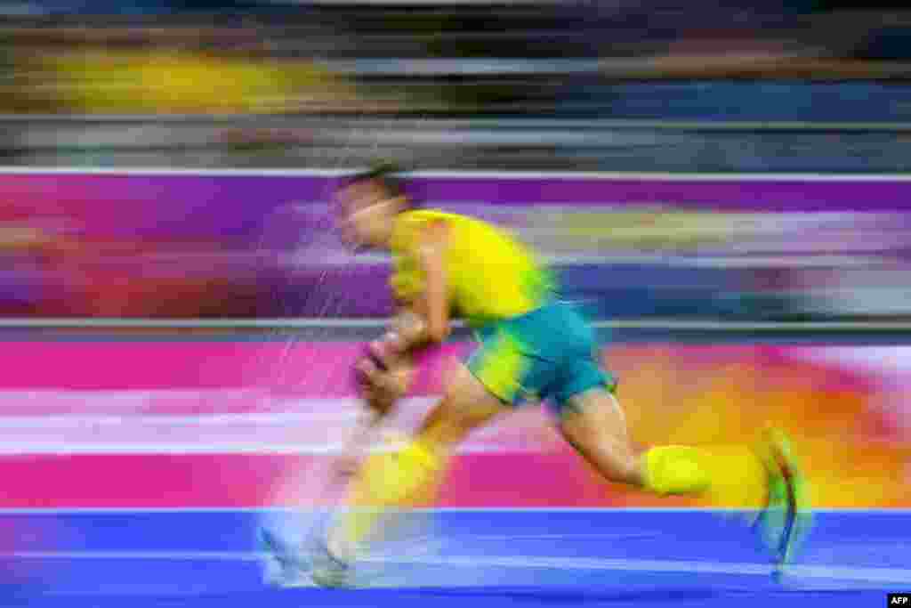 Australia's Tom Craig makes a run with the ball against England during their men's field hockey semi-final match at the 2018 Gold Coast Commonwealth Games in Australia.