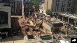 Emergency personnel respond to a building collapse in downtown Philadelphia, June 5, 2013.