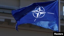 NATO flag flutters during the celebration of the 15th anniversary of Lithuania's membership in NATO in Vilnius, Lithuania, March 30, 2019.