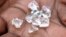 FILE - Illegal diamonds from Zimbabwe are displayed for sale in Manica, Mozambique.