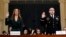 Jennifer Williams, an aide to Vice President Mike Pence, left, and National Security Council aide Lt. Col. Alexander Vindman, are sworn in to testify before the House Intelligence Committee on Capitol Hill in Washington, Nov. 19, 2019, during a public imp