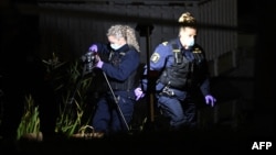 Police forensics officers work near the Israeli Embassy in Stockholm, Sweden, after a suspected shooting on Oct. 1, 2024.