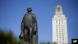 FILE - In this Nov. 29, 2012 file photo, a statue of George Washington stands near the University of Texas Tower at the center of campus, in Austin, Texas.The campus dominates most of downtown.