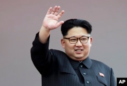 FILE - North Korean leader Kim Jong Un waves at parade participants at Kim Il Sung Square in Pyongyang, North Korea, May 10, 2016.