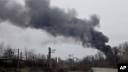 FILE - Smoke rises from an energy facility after a Russian attack in Kharkiv, Ukraine, March 22, 2024.