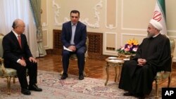 Presiden Iran Hassan Rouhani (kanan) menerima kunjungan Kepala IAEA Yukiya Amano di Teheran, hari Minggu (20/9).