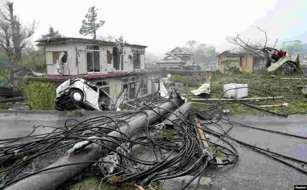 Destroyed houses, cars and power poles, which according to local media were believed to be caused by a tornado, are seen as Typhoon Hagibis approaches the Tokyo area in Ichihara, east of Tokyo, Japan, Oct. 12, 2019. (Credit: Kyodo)