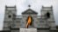 A candle burns outside St. Anthony's Shrine a week after a string of suicide bomb attacks across the island on Easter, in Colombo, Sri Lanka, April 28, 2019.