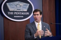 FILE - U.S. Secretary of Defense Mark Esper speaks to reporters during a briefing at the Pentagon, Aug. 28, 2019.