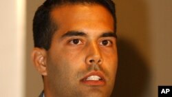 FILE - George Prescott Bush speaks during a news conference in Mexico City, Aug. 21, 2004, to try to persuade American registered voters living in Mexico to support his uncle, George W. Bush, in the presidential election. George P. Bush is now Texas land 