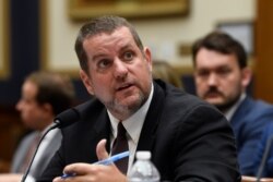 FILE - Senior Cybersecurity Adviser at the Department of Homeland Security Matthew Masterson testifies on Capitol Hill in Washington, Oct. 22, 2019.
